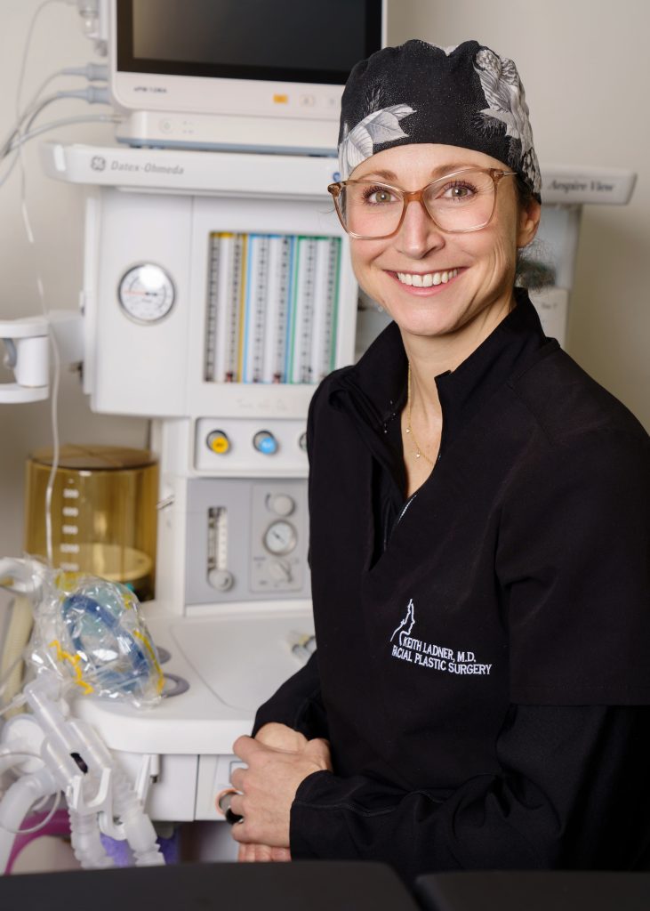 Dr. Meagan Gold in black scrubs