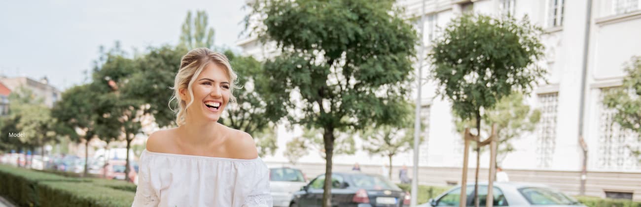 Woman sitting in the park smiling