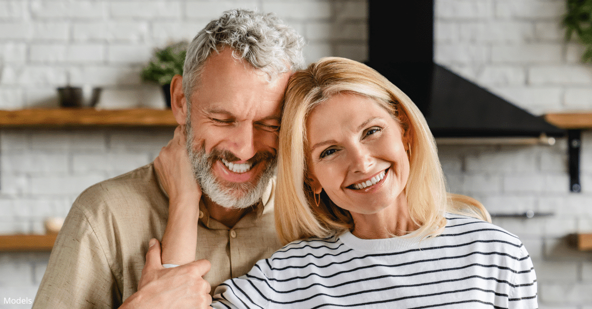 Couple smiling in their Denver, Colorado home