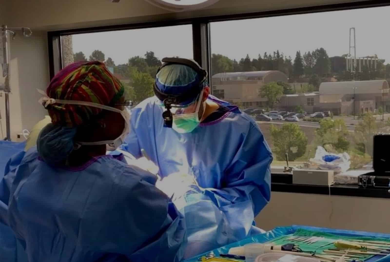 Doctor operating on a patient