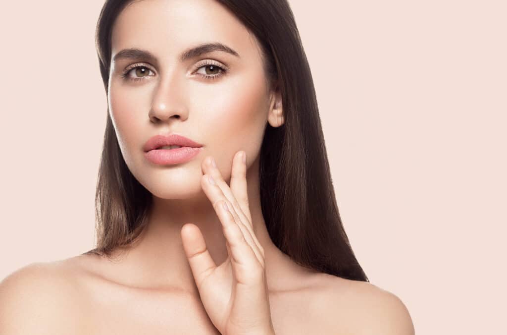 Woman has full, voluminous face thanks to facial procedures like facial fat grafting