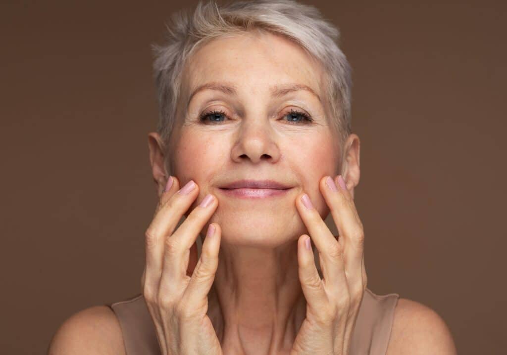 Attractive woman in her 60s has recovered from cosmetic blepharoplasty