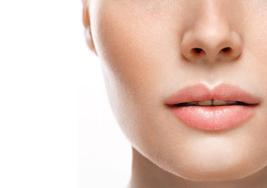Close-up of woman's augmented and lifted lips