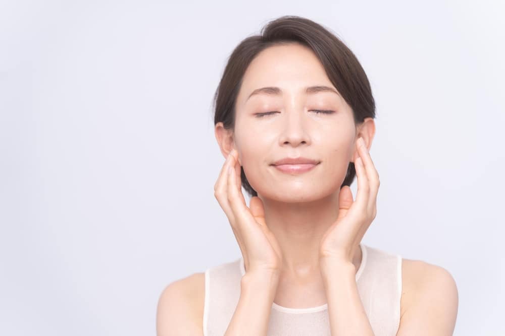 Woman has fuller round cheeks after adding fat to her face.